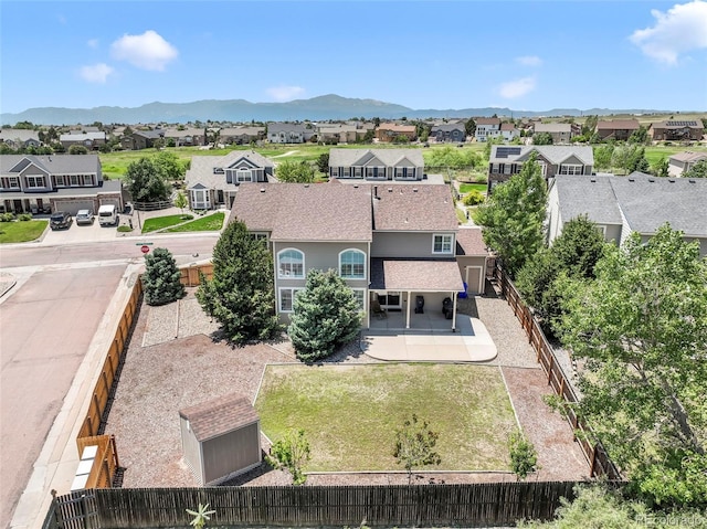 9005 Royal Melbourne Cir, Peyton, CO 80831 - aerial perspective of suburban area featuring a mountainous background