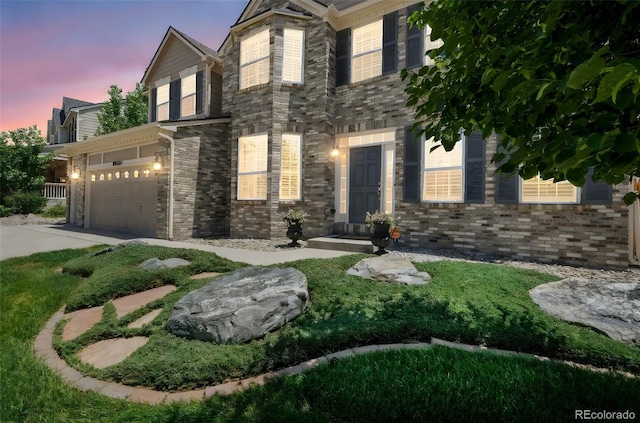 9005 Royal Melbourne Cir, Peyton, CO 80831 - view of front of home featuring concrete driveway and brick siding