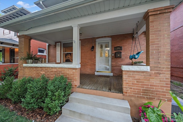 doorway to property featuring a porch