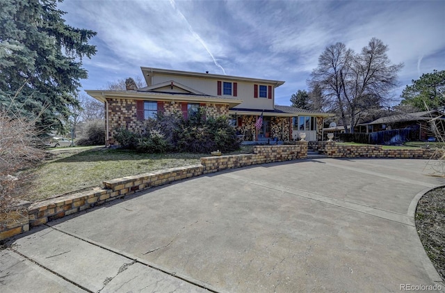 front facade with a front yard