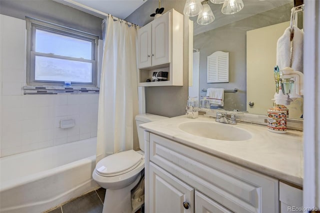 full bathroom with vanity, toilet, tile patterned flooring, and shower / bath combo with shower curtain