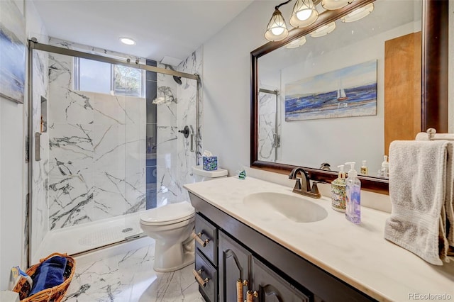 bathroom featuring vanity, toilet, and walk in shower