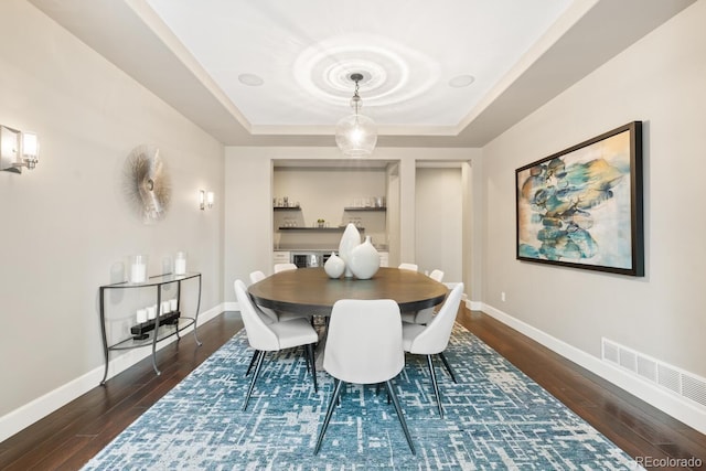 237 Maplehurst Dr, Highlands Ranch, CO 80126 - dining area featuring wood finished floors, a raised ceiling, and baseboards