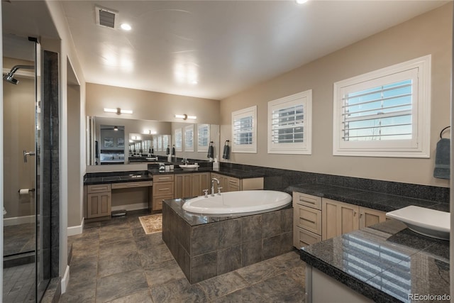 237 Maplehurst Dr, Highlands Ranch, CO 80126 - bathroom with plenty of natural light, a bath, vanity, and a shower stall