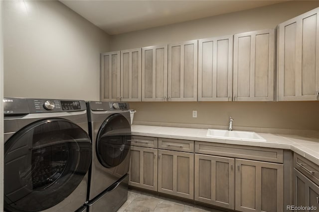 237 Maplehurst Dr, Highlands Ranch, CO 80126 - washroom with washer and dryer, cabinet space, and light tile patterned floors