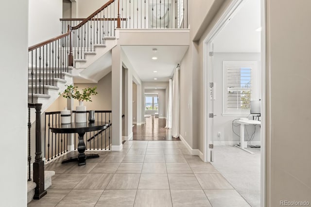 237 Maplehurst Dr, Highlands Ranch, CO 80126 - foyer entrance featuring a high ceiling, baseboards, and stairs