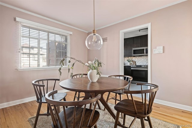 1410 Vine St Unit 3, Denver, CO 80206 - dining area with baseboards, light wood-style floors, and crown molding