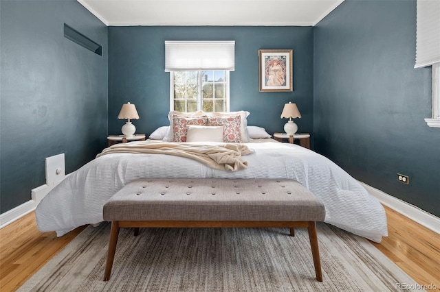 1410 Vine St Unit 3, Denver, CO 80206 - bedroom featuring wood finished floors, baseboards, and crown molding