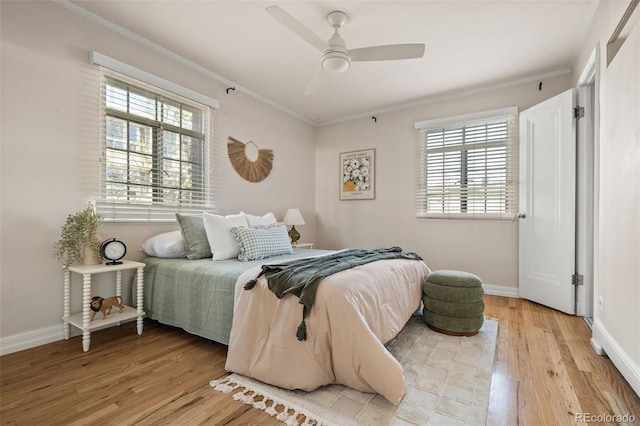 1410 Vine St Unit 3, Denver, CO 80206 - bedroom with crown molding, light wood-type flooring, baseboards, and ceiling fan