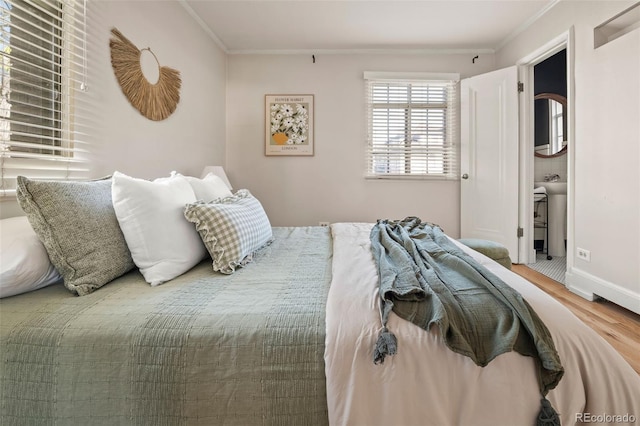 1410 Vine St Unit 3, Denver, CO 80206 - bedroom with wood finished floors, ornamental molding, and baseboards