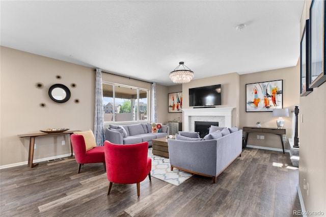 living room with dark wood-style floors, a fireplace, and baseboards