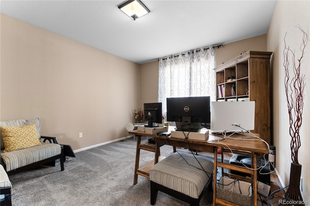 carpeted home office with baseboards