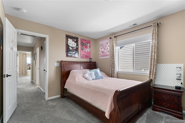 carpeted bedroom with baseboards