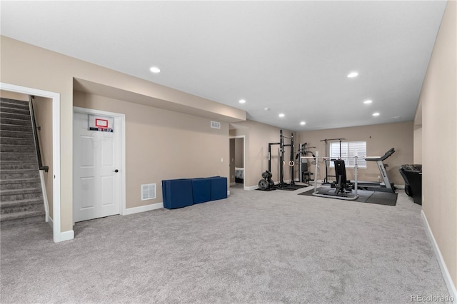 exercise room with carpet flooring, recessed lighting, and baseboards