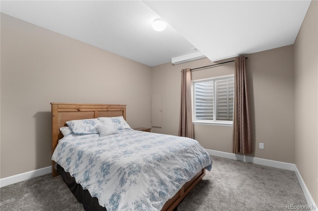 bedroom featuring light colored carpet and baseboards