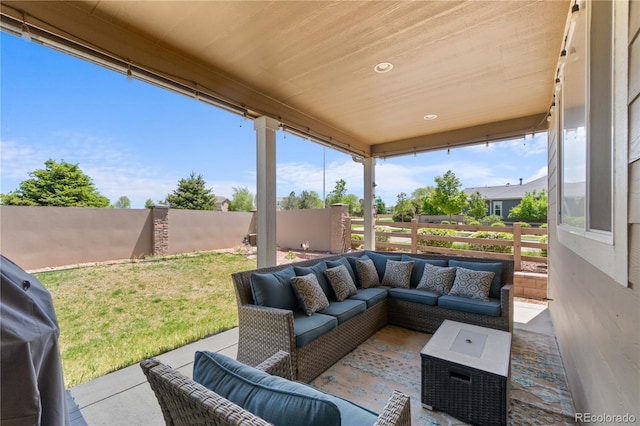 view of patio featuring an outdoor living space and a grill