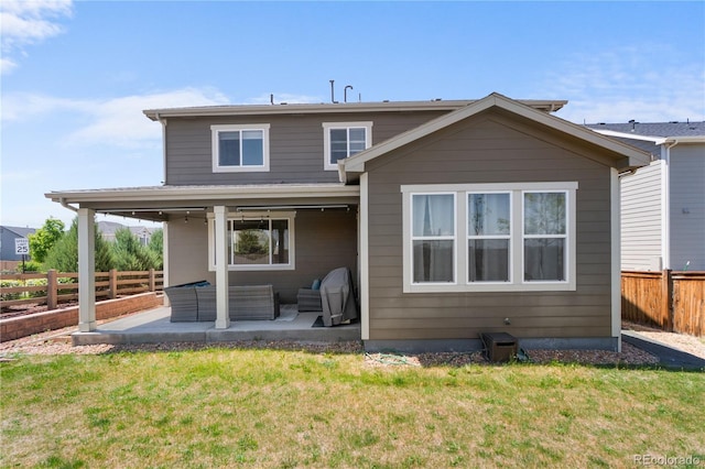 back of house with an outdoor living space and a patio area