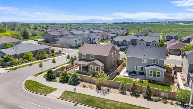 aerial view of residential area with a mountain backdrop