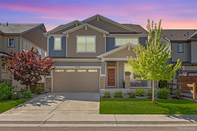 15608 E Otero Cir, Centennial, CO 80112 - craftsman-style house with concrete driveway, a porch, a lawn, an attached garage, and stone siding