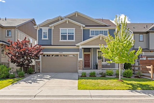15608 E Otero Cir, Centennial, CO 80112 - craftsman-style home with a porch, concrete driveway, an attached garage, and stone siding