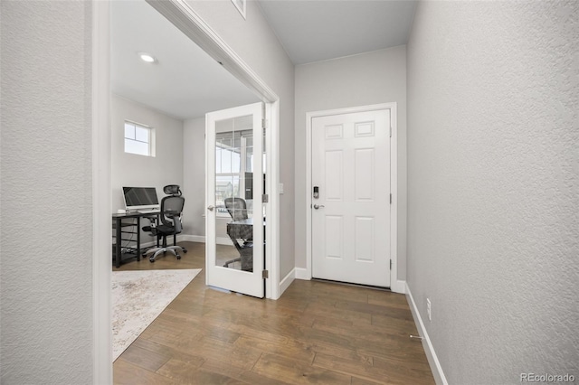 15608 E Otero Cir, Centennial, CO 80112 - entryway featuring dark wood-type flooring, a textured wall, and baseboards
