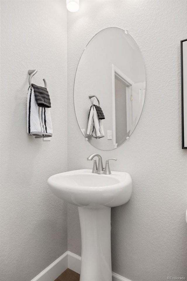 15608 E Otero Cir, Centennial, CO 80112 - bathroom with baseboards and a sink
