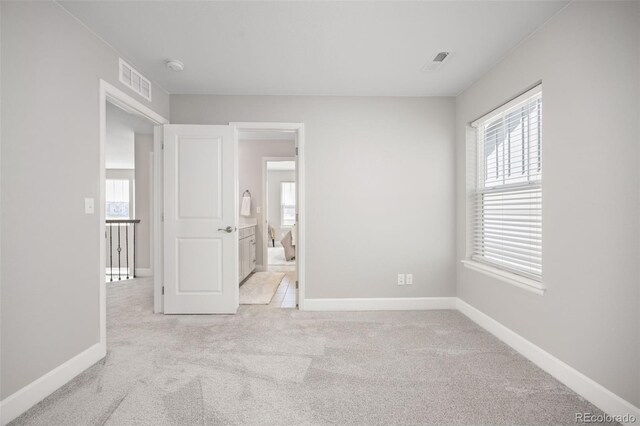 15608 E Otero Cir, Centennial, CO 80112 - unfurnished bedroom with carpet flooring, multiple windows, and baseboards