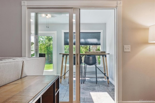 6537 S Brentwood Way, Littleton, CO 80123 - doorway to outside with baseboards and stone finish floors