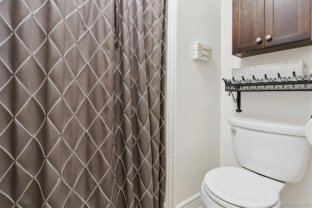 6537 S Brentwood Way, Littleton, CO 80123 - bathroom with toilet and a shower with curtain