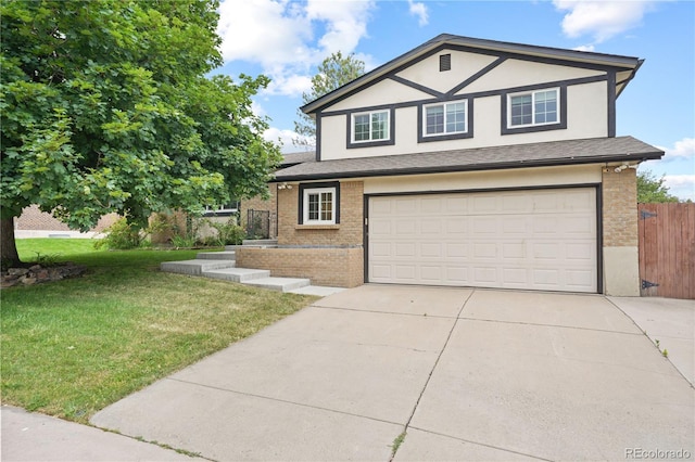 6451 S Hoyt St, Littleton, CO 80123 - view of front of house with an attached garage, brick siding, concrete driveway, and stucco siding
