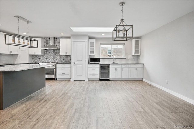 6451 S Hoyt St, Littleton, CO 80123 - kitchen featuring backsplash, a chandelier, glass insert cabinets, white cabinets, and recessed lighting