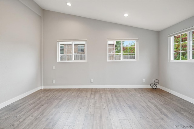 6451 S Hoyt St, Littleton, CO 80123 - empty room featuring lofted ceiling, light wood finished floors, plenty of natural light, and recessed lighting