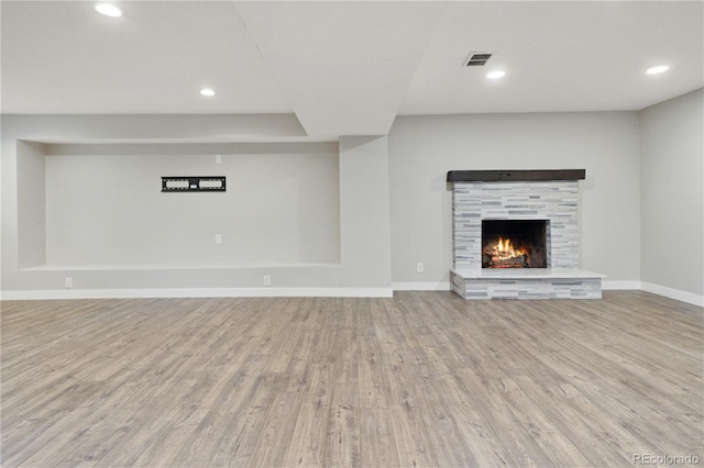 6451 S Hoyt St, Littleton, CO 80123 - unfurnished living room with wood finished floors, a fireplace, and recessed lighting