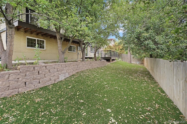 6451 S Hoyt St, Littleton, CO 80123 - fenced backyard featuring a wooden deck