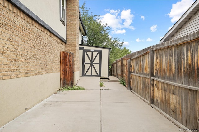 6451 S Hoyt St, Littleton, CO 80123 - fenced backyard with a storage shed and a patio