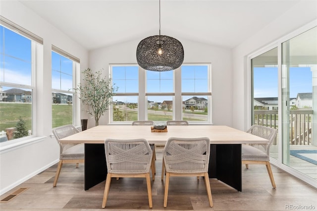 sunroom featuring plenty of natural light and visible vents