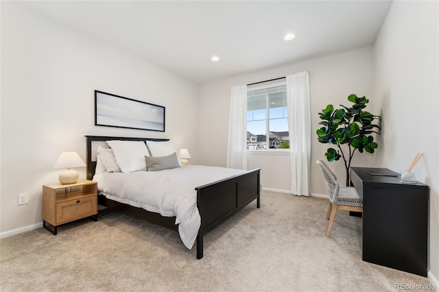 bedroom featuring recessed lighting, baseboards, and light carpet