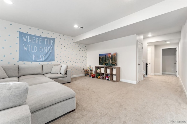 living area with carpet floors, baseboards, and visible vents