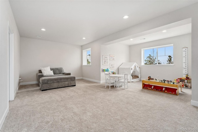 interior space with a healthy amount of sunlight, carpet flooring, and recessed lighting