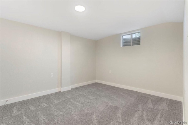 carpeted empty room with baseboards