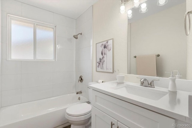 full bath with toilet, vanity, and  shower combination