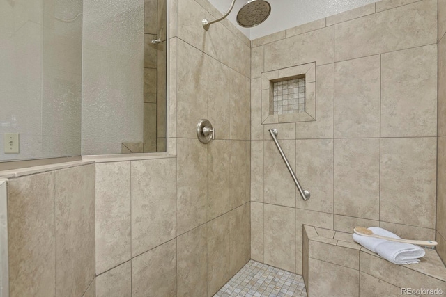 bathroom featuring a tile shower