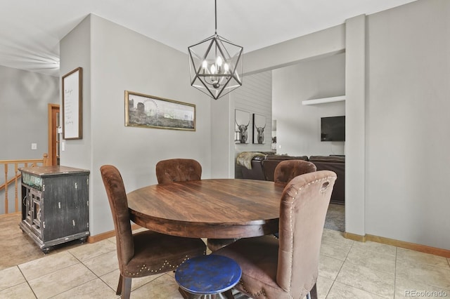 tiled dining space featuring a chandelier