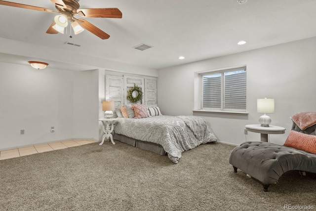 bedroom featuring ceiling fan and light colored carpet