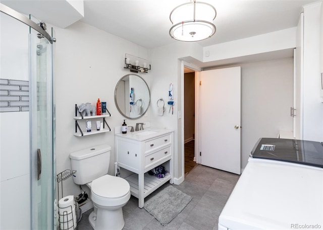bathroom with tile patterned flooring, toilet, a stall shower, and vanity