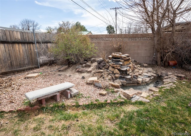 view of yard featuring a fenced backyard