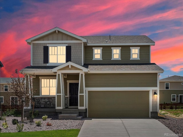 4694 Sugarcane St, Johnstown, CO 80534 - craftsman house with an attached garage, driveway, and roof with shingles
