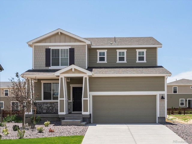 4694 Sugarcane St, Johnstown, CO 80534 - craftsman inspired home featuring a garage, concrete driveway, and roof with shingles