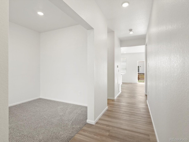 4694 Sugarcane St, Johnstown, CO 80534 - corridor with wood finished floors and recessed lighting