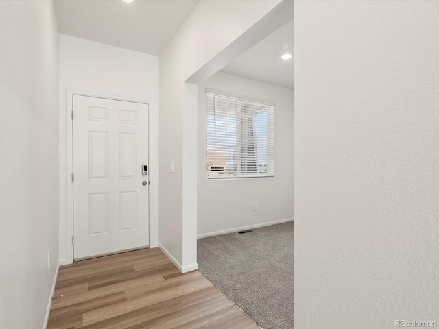 4694 Sugarcane St, Johnstown, CO 80534 - entrance foyer featuring light wood-type flooring and recessed lighting